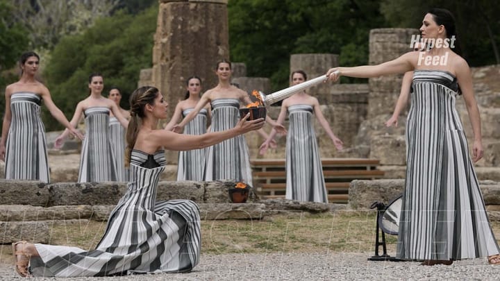 Cloudy skies halt Olympic torch journey as sun fails to spark ignition.